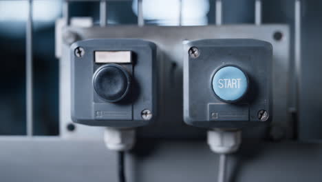 Factory-machine-stop-button-on-technological-manufacture-automat-panel-closeup