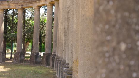 Slow-motion-panning-shot-revealing-a-circular-stone-column-designed-courtyard-at-Chateau-de-Castille