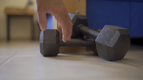 neglecting or passing on workout - man decides not to pick up weights