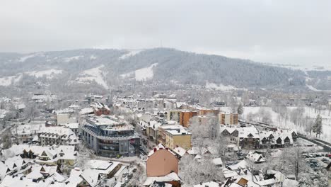 Drone-Aerial-of-famous-Krupówki-Street-Zakopane-in-winter-snow