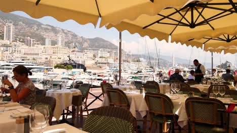 woman dining at a marina restaurant