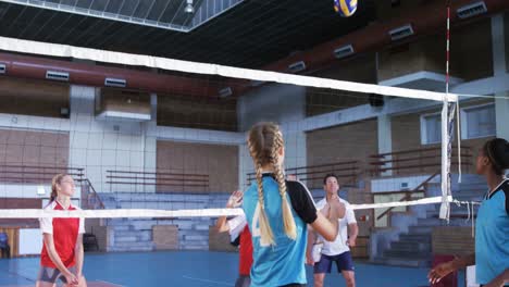 female players playing volleyball in the court 4k