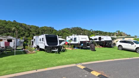 campers setting up at a sunny rv campground