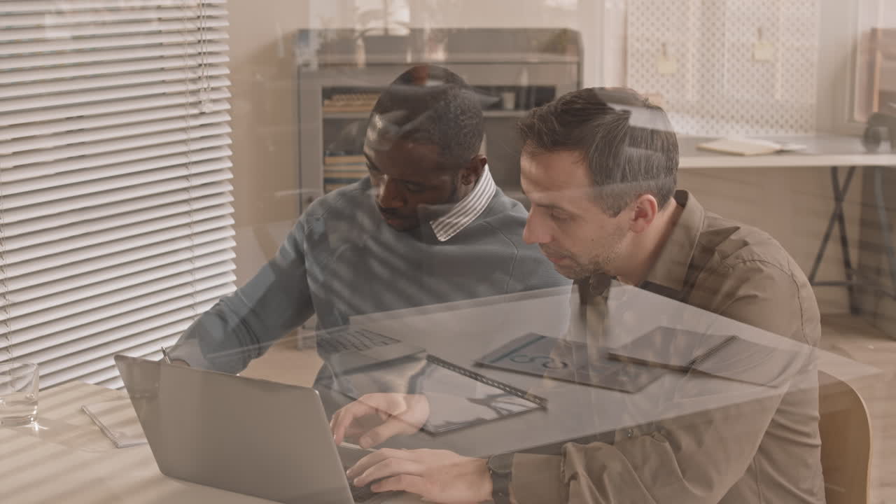 Colleagues Working Behind Glass