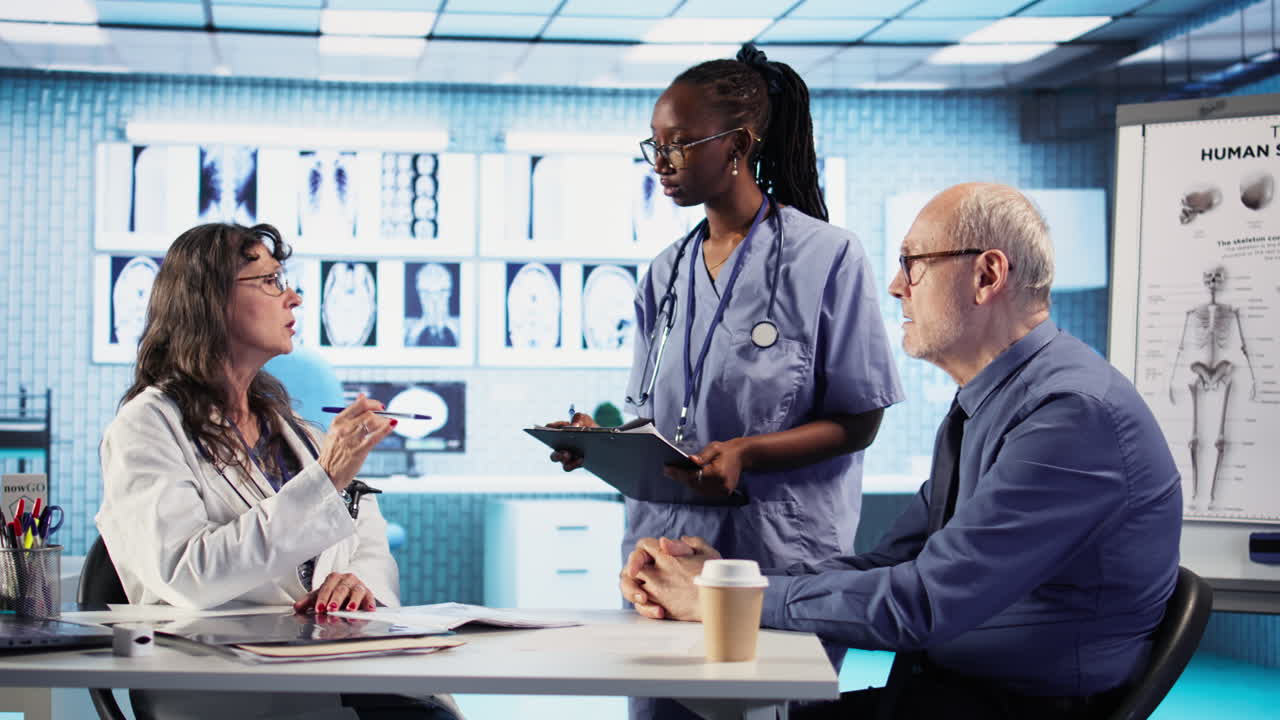 Vertical Video Medic and african american nurse offer support to old man during checkup