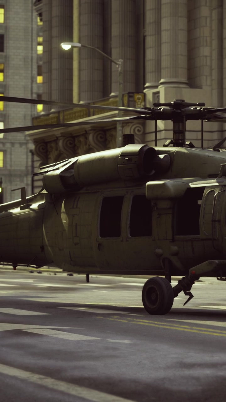 Helicopter is parked on city street near tall buildings during daytime