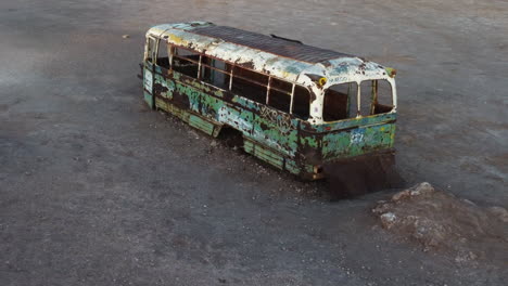 Aerial-descends-to-Magic-Bus-tourist-attraction-in-remote-Chile-desert