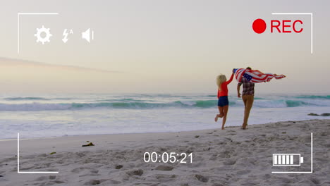 filmando una pareja en una playa con una cámara digital 4k