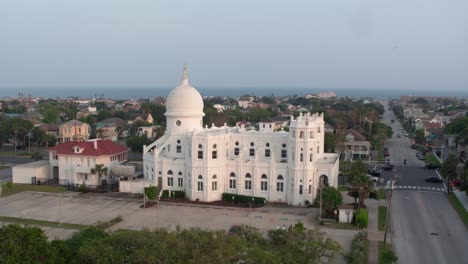 Drone-view-of-Sacred-Heart-Catholic-Church-and-surrounding-area-in-Galveston,-Texas