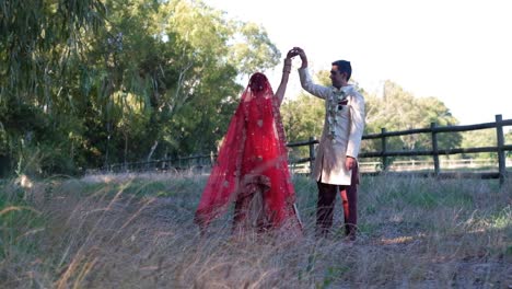 Indian-Hindu-Groom-And-Bride-Dancing-Outdoors---Slow-Motion