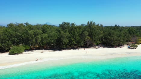 Tropical-island-crystal-clear-water-of-Indonesia,-aerial-motion-background