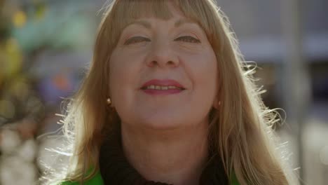 close up portrait of beautiful middle aged lady looking at camera