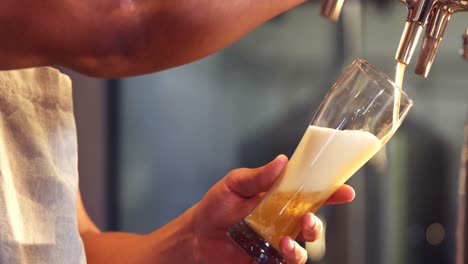 brewer filling beer in beer glass from beer pump 4k