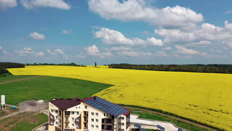 modern buildings in village. aerial shot of home with solar system in residential area in countryside