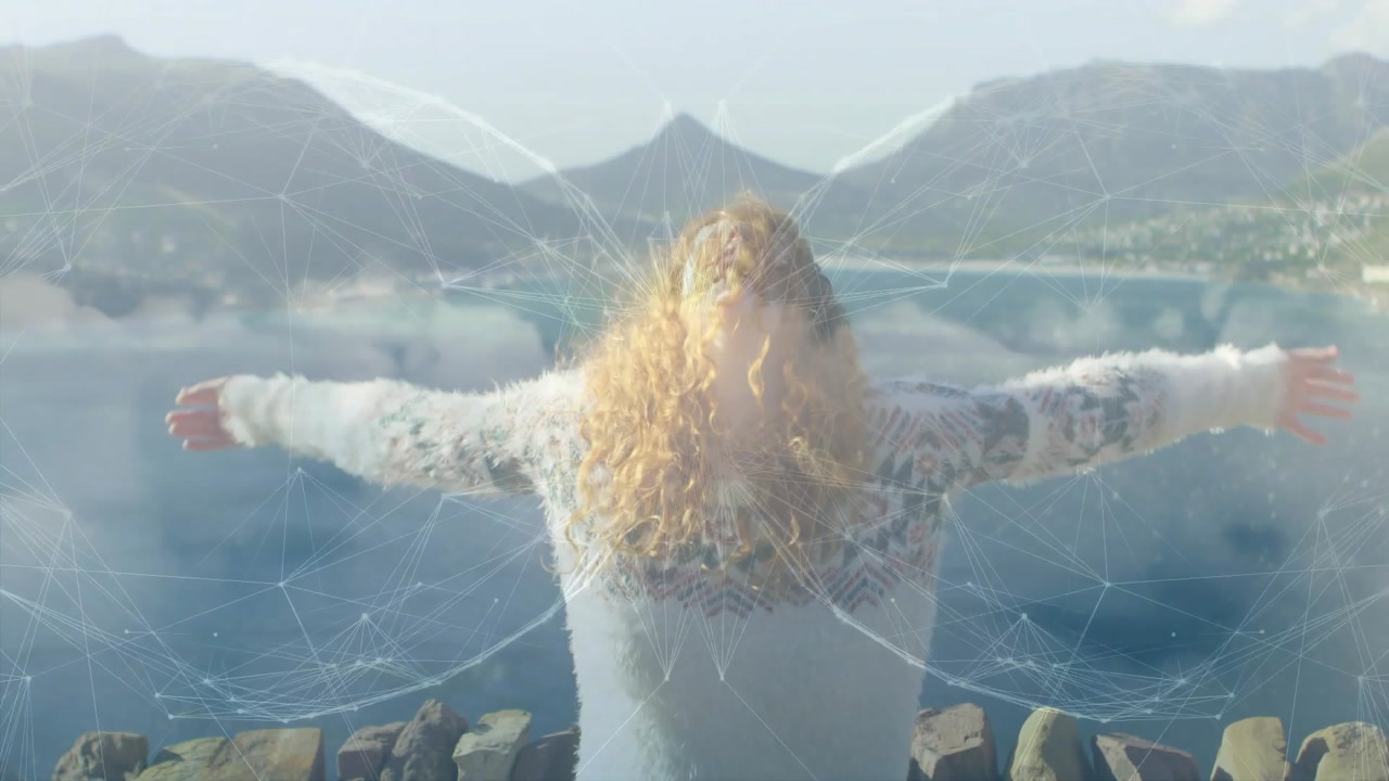 Vertical video: Woman on rock wall bay, circle growing on back causing arms opening into tech wings