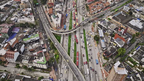 Bogota-Colombia-Aerial-v47-establishing-birds-eye-view,-drone-fly-along-Avenue-NQS-capturing-busy-highway-vehicle-traffics-on-the-routes-and-La-Soledad-views---Shot-with-Mavic-3-Cine---November-2022