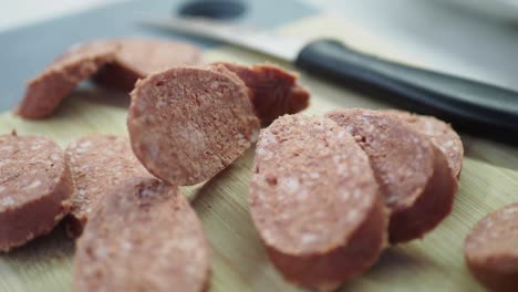 sliced raw sausage on a cutting board