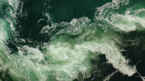 waves of water of the river and the sea meet each other during high tide and low tide.