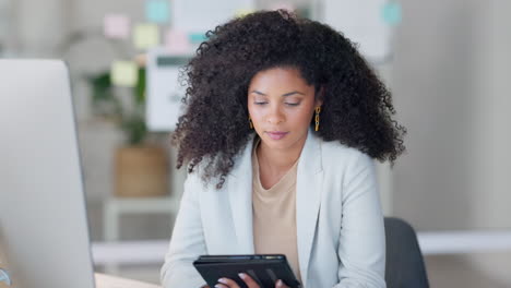 Portrait-of-a-black-business-woman-using-a-tablet