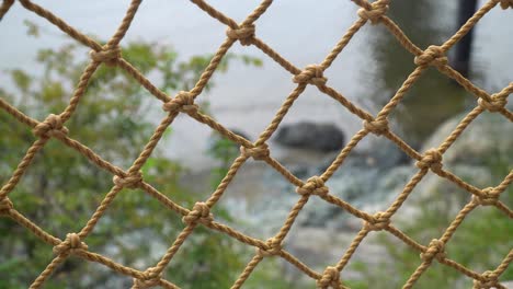 Rope-Net-Barrier-On-Seashore-Of-Beach-Resort-At-Daytime