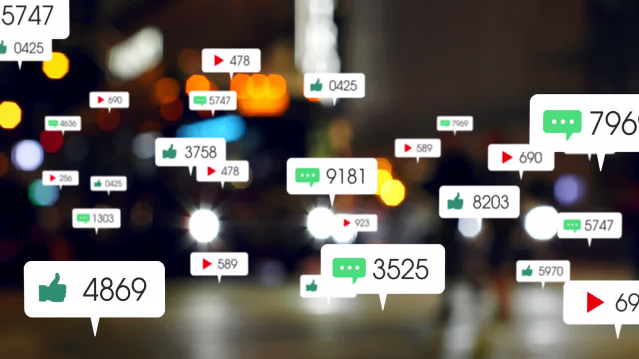Animation of social media icons and numbers over out of focus traffic lights