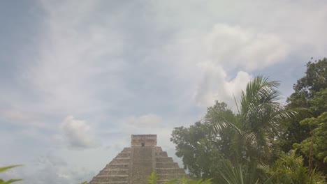 gimbal wide booming down shot of the ancient mayan pyramid el castillo at chichen itza in yucatan, mexico. 4k