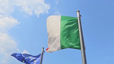 united line of european union and italian flag standing tall with strength