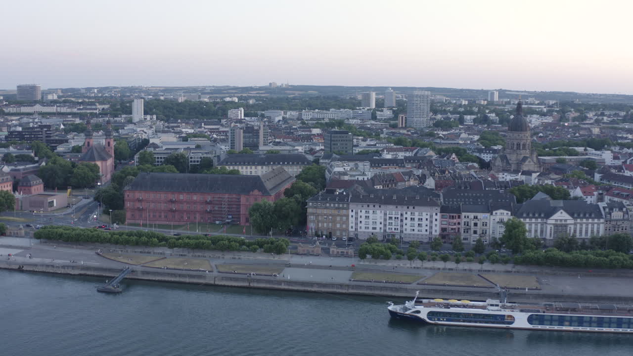 Aerial circling Drone View of Mainz with Castle, dom, Theodor Heuss Bridge and Cityscape at Sunset – Rhine River, Germany