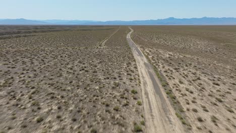 dirt road through desert landscape of charyn canyon national park in kazakhstan