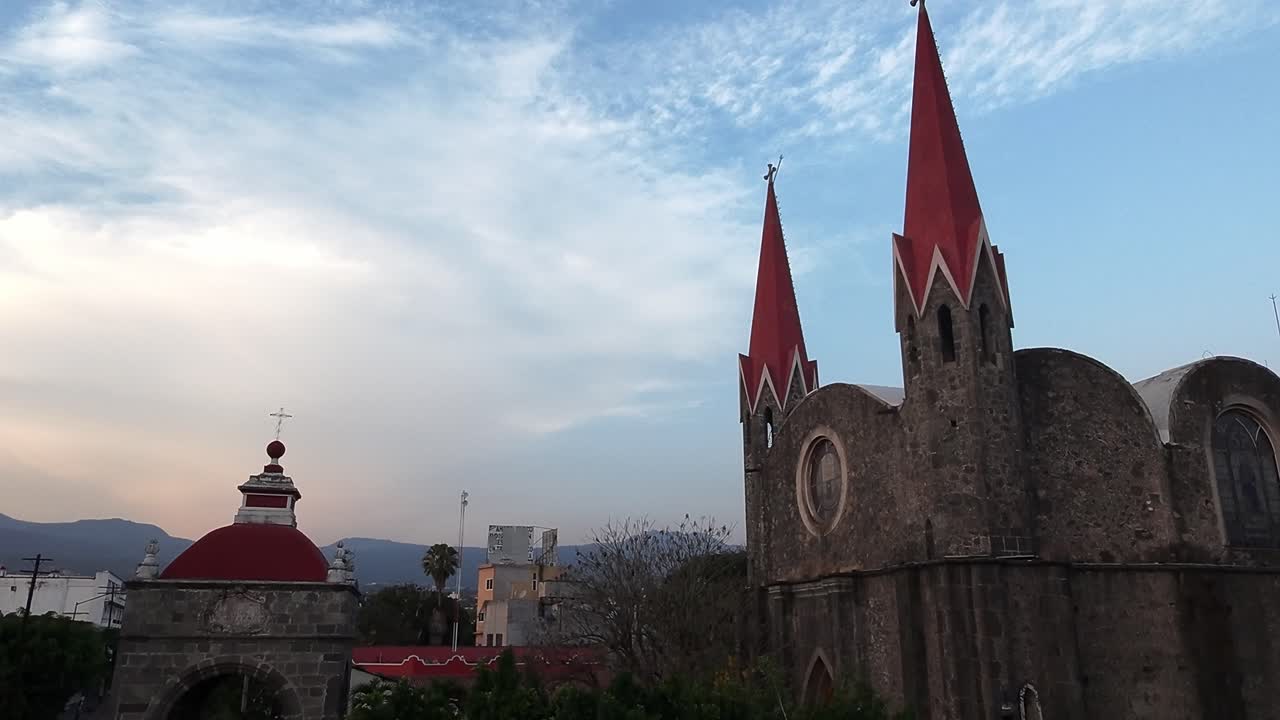 Iglesia del Calvario in Cuernavaca with its distinctive red rooftops under a blue sky