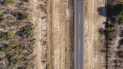 Aerial-view-over-the-north-to-south-road-of-the-transpeninsular-highway-in-Baja-California-Sur,-Mexico