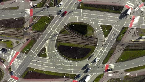 aerial: large roundabout with intersections in city