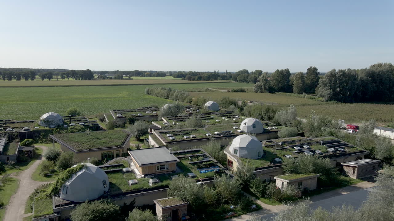 Aerial View of an Eco-Community with Dome Houses and Green Roofs