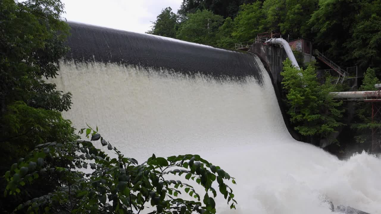 Scenic shots of the Cuyahoga River at Gorge Dam in Summit County, Ohio, where a man-made waterfall and reservoir meet a revitalized natural landscape near Akron and Cuyahoga Falls.