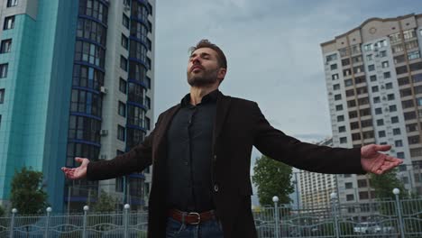 man relaxing in cityscape