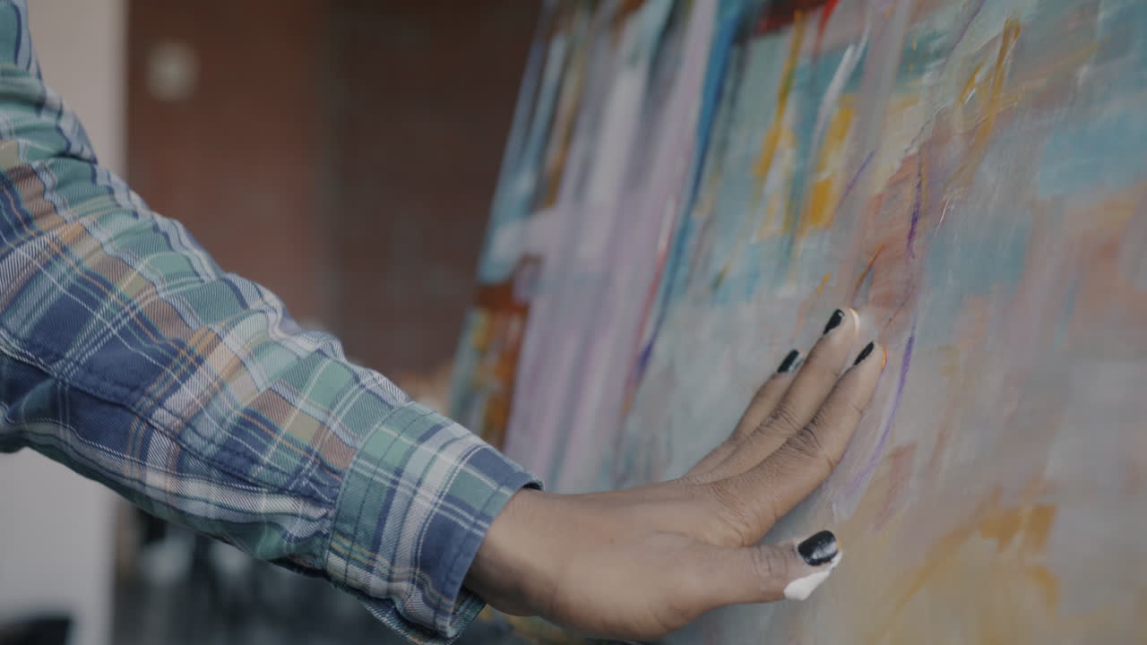 Woman painting abstract artwork