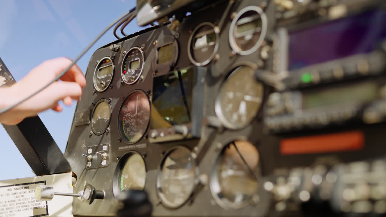 Pilot's Hand Operating Controls and Instruments in Airplane Cockpit