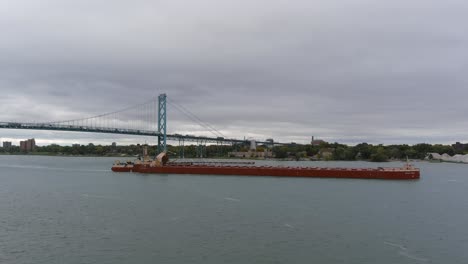 Drone-view-of-large-tanker-in-the-Detroit-River-in-Detroit,-Michigan