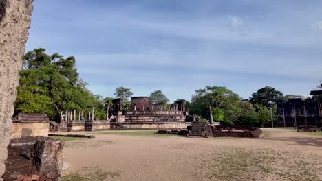 view of the historic polonnaruwa vatadage in sri lanka surrounded by greenery and clear skies. the ancient ruins demonstrate cultural heritage and architectural beauty.