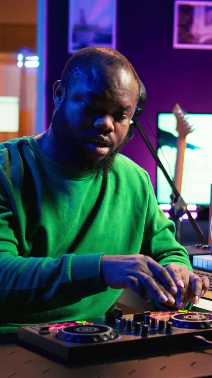African American DJ Mixing Music in a Vibrant Home Studio