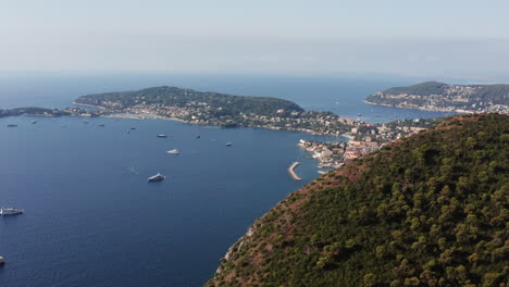 cinematic aerial flight showing luxury boats, beautiful city and port of beaulieu sur mer in france