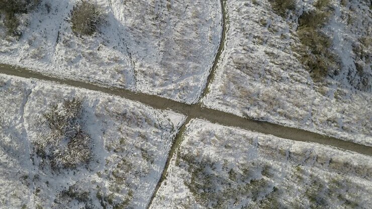 A hiking trail through the snow covered landscape in Granada, Spain - top view