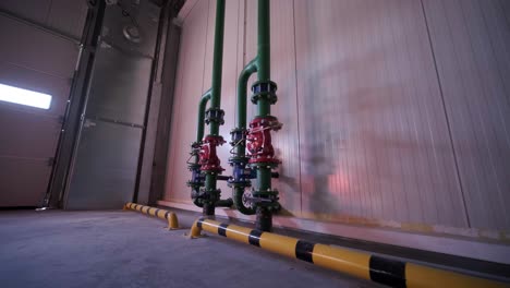 the water-based fire protection system is installed at a large factory. there is a pipe with a sprinkler.