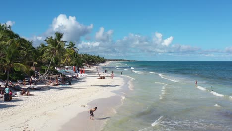 low altitude forward tracking aerial drone shot of caribbean tropical beach