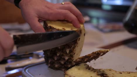 Cutting-Skin-Off-Pineapple-with-Knife-in-Slow-Motion