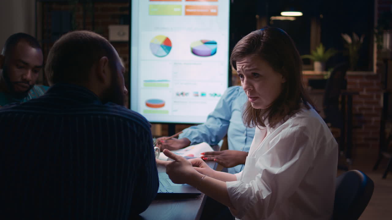 Employee talking in business team meeting, discussing report presentation