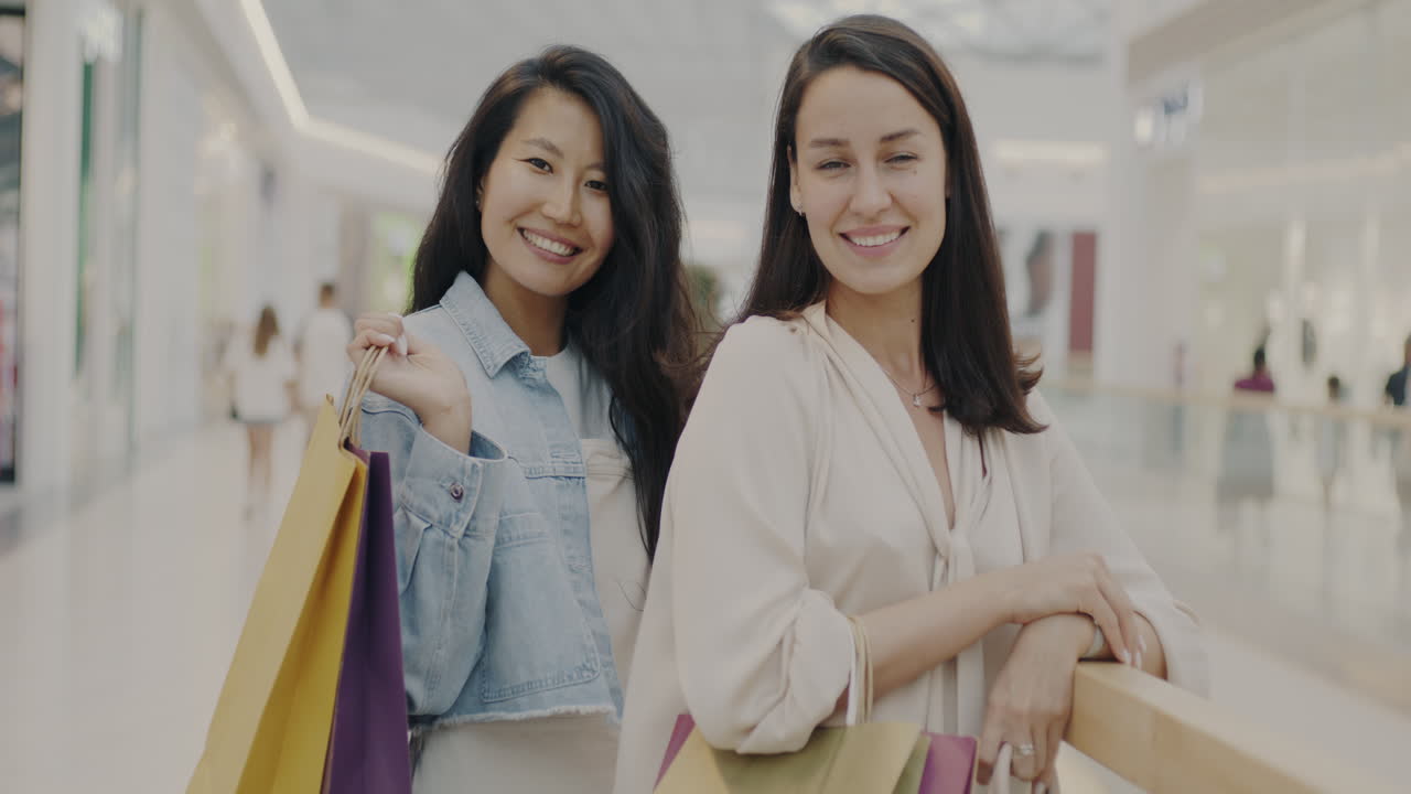 Two women shopping at a mall