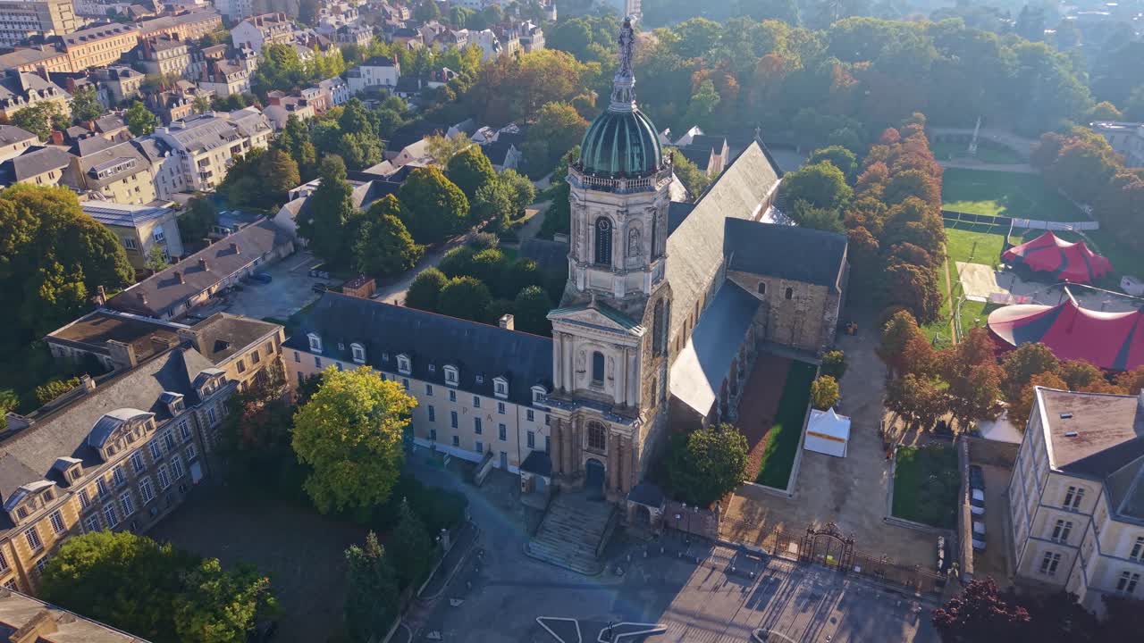 Distant panorama drone fly to the historic Church of Our Lady of Saint Melaine aka Église Notre-Dame-en-Saint-Melaine in autumn, Rennes, Ille-et-Vilaine, France