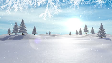 christmas tree branches over snow falling over multiple trees on winter landscape against blue sky