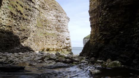 a stream trickling out to sea